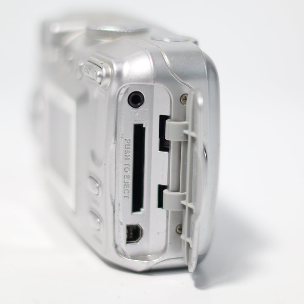 Close-up of a small electronic device with ports on a white background