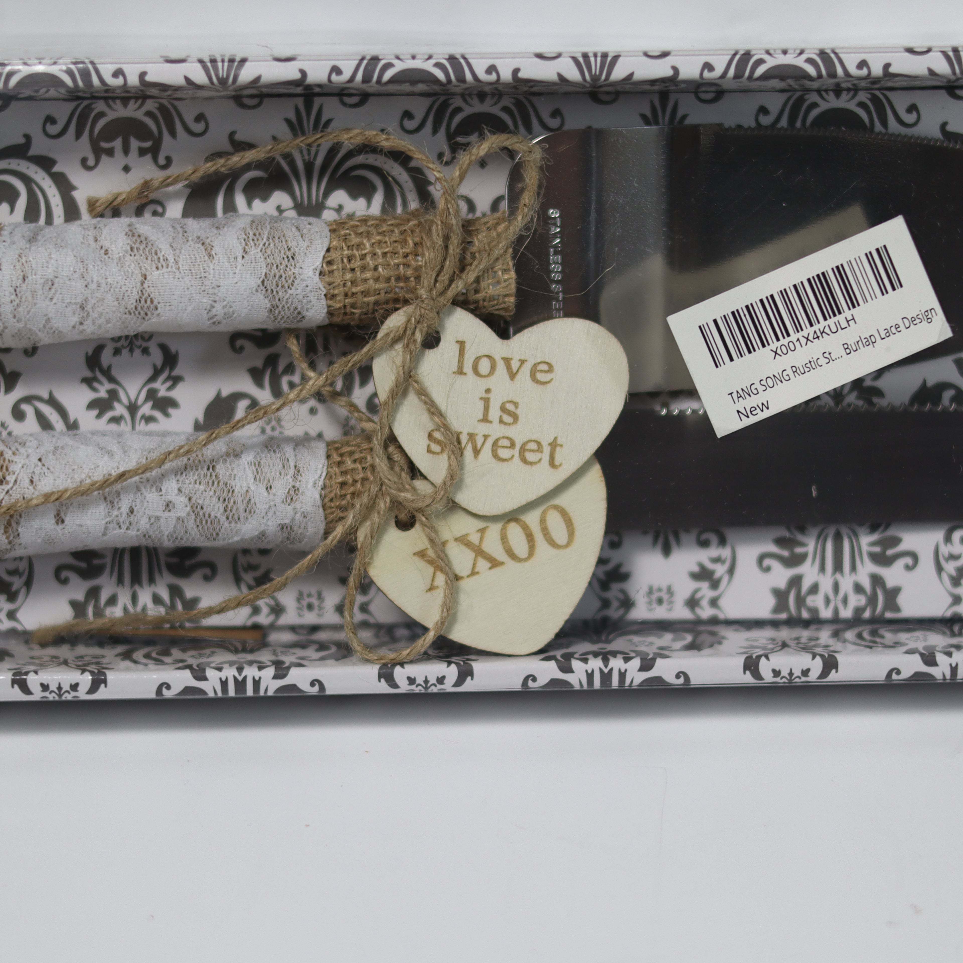 Packaged product with decorative tag and ribbon on a white background