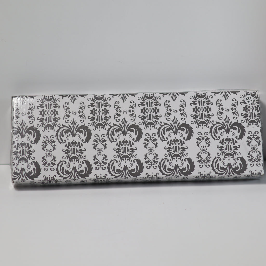 Rectangular box with decorative black and white pattern on a gray background