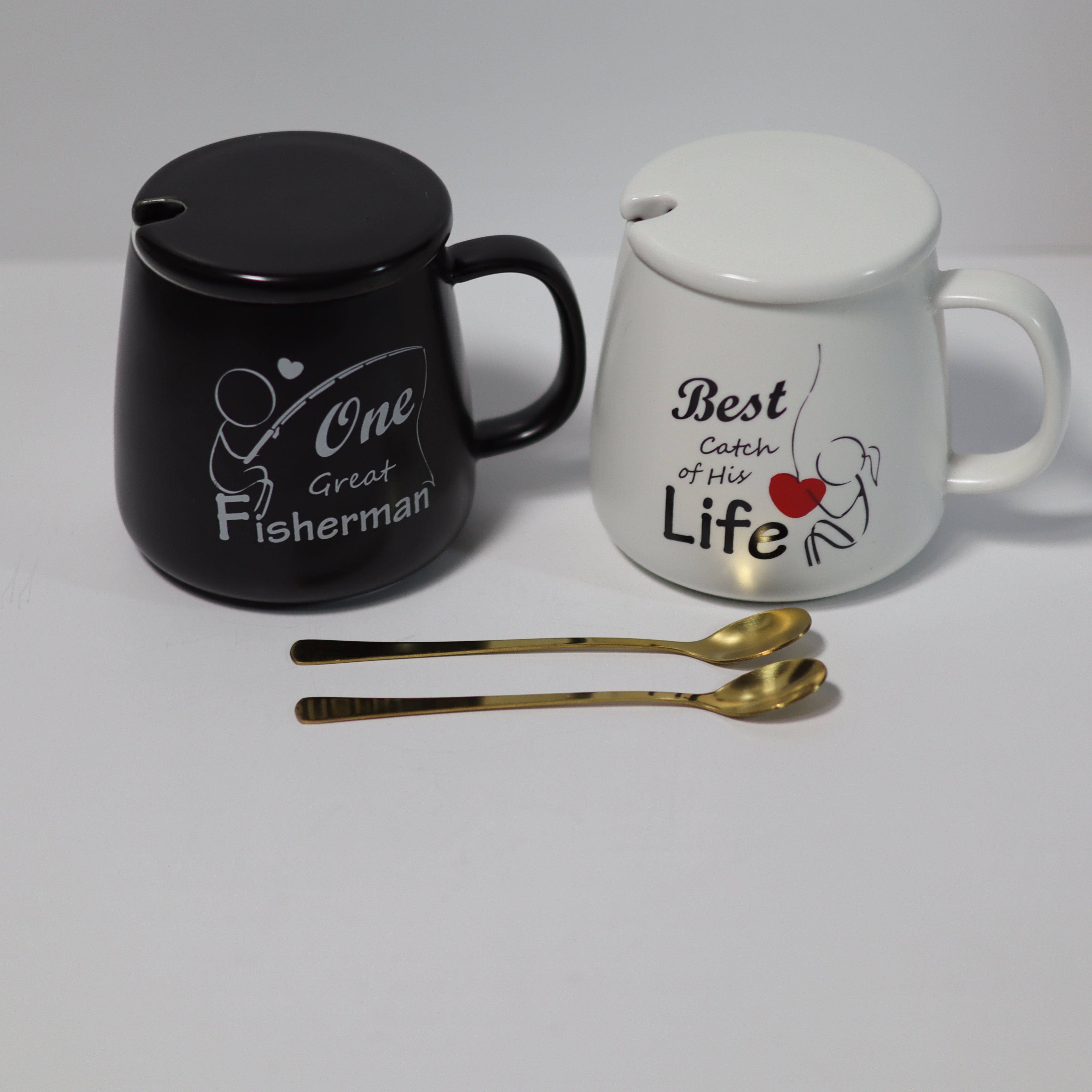 Black mug with 'One Great Fisherman' text and white mug with 'Best Catch of His Life' text on a gray background.