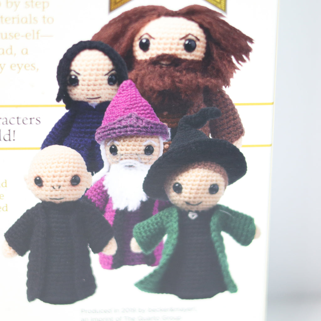 Crocheted characters resembling famous wizarding figures from a book or magazine.