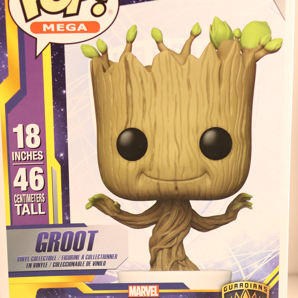 Funko Pop! Groot figure with packaging displaying height and Marvel branding.
