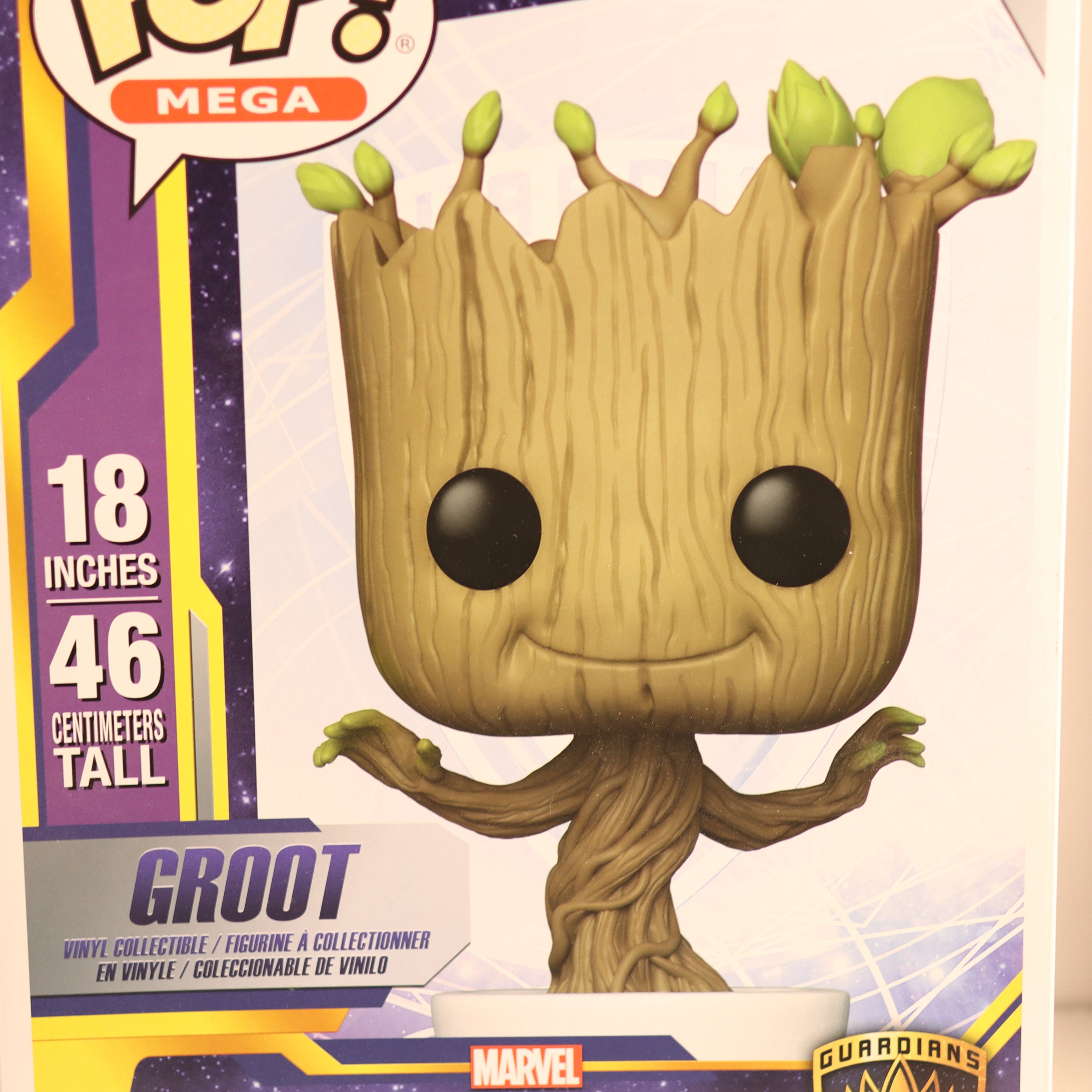 Funko Pop! Groot figure with packaging displaying height and Marvel branding.