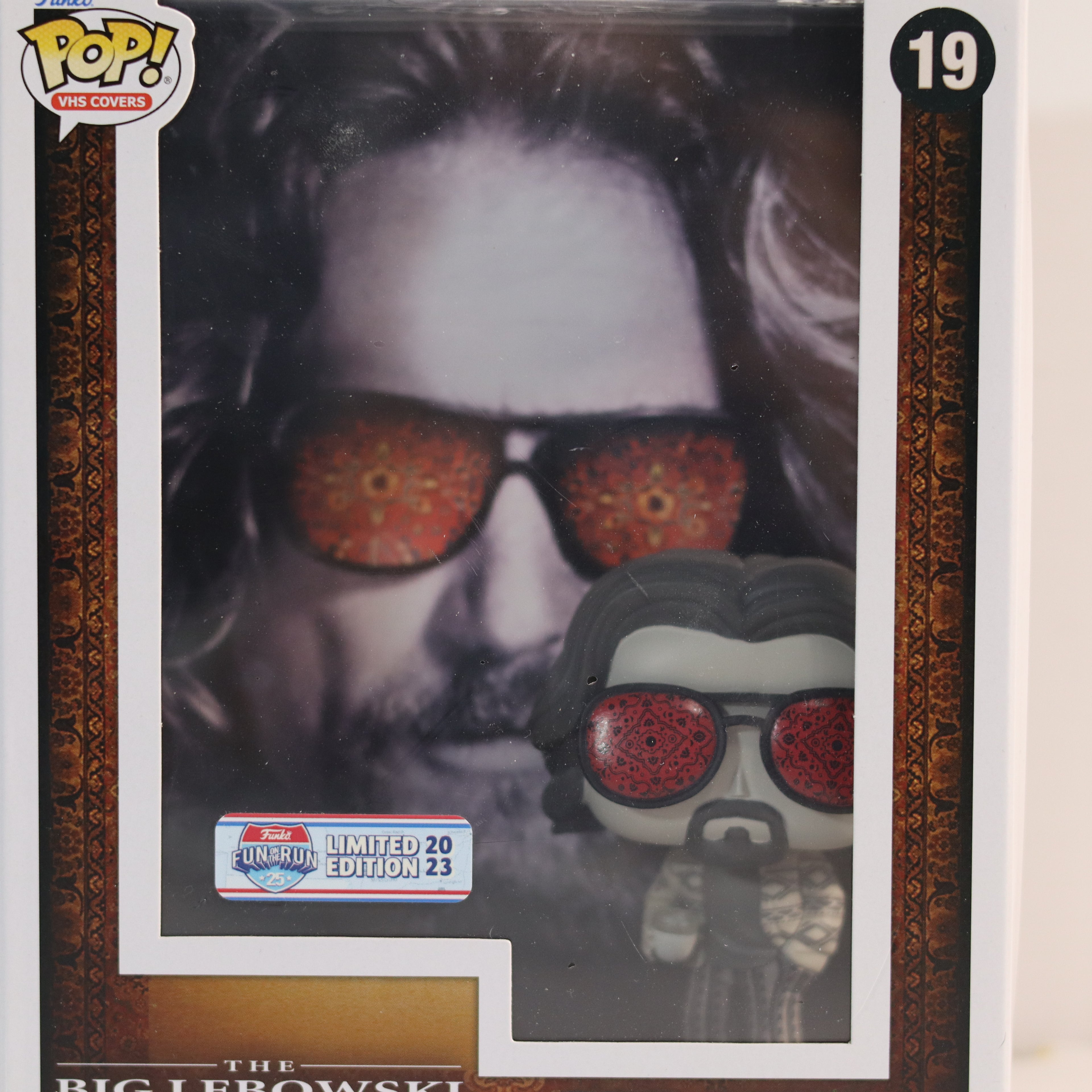 Pop! Vinyl figure packaging with sunglasses and 'The Big Lebowski' branding.