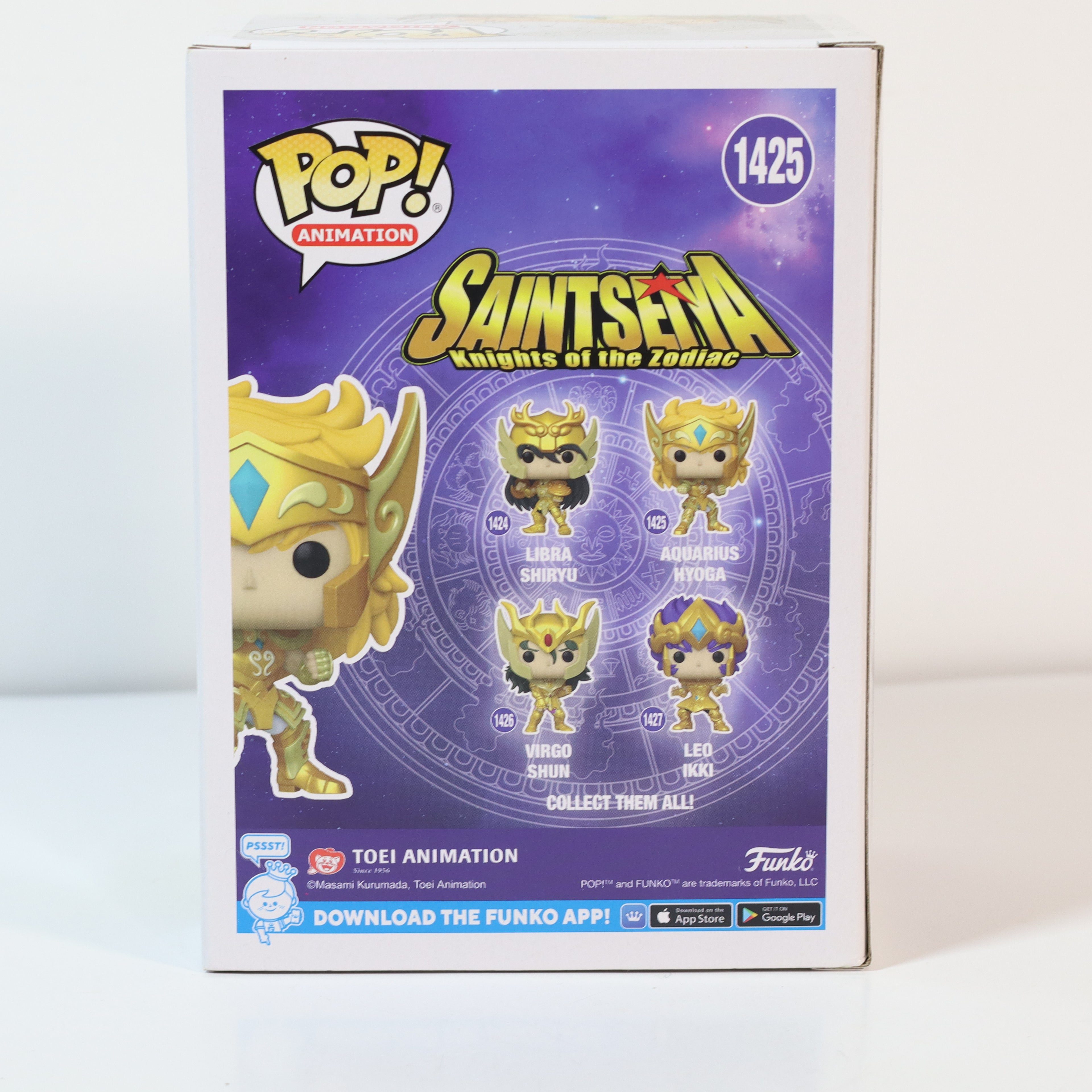 Funko Pop! packaging for Saint Seiya with character illustrations on a purple background