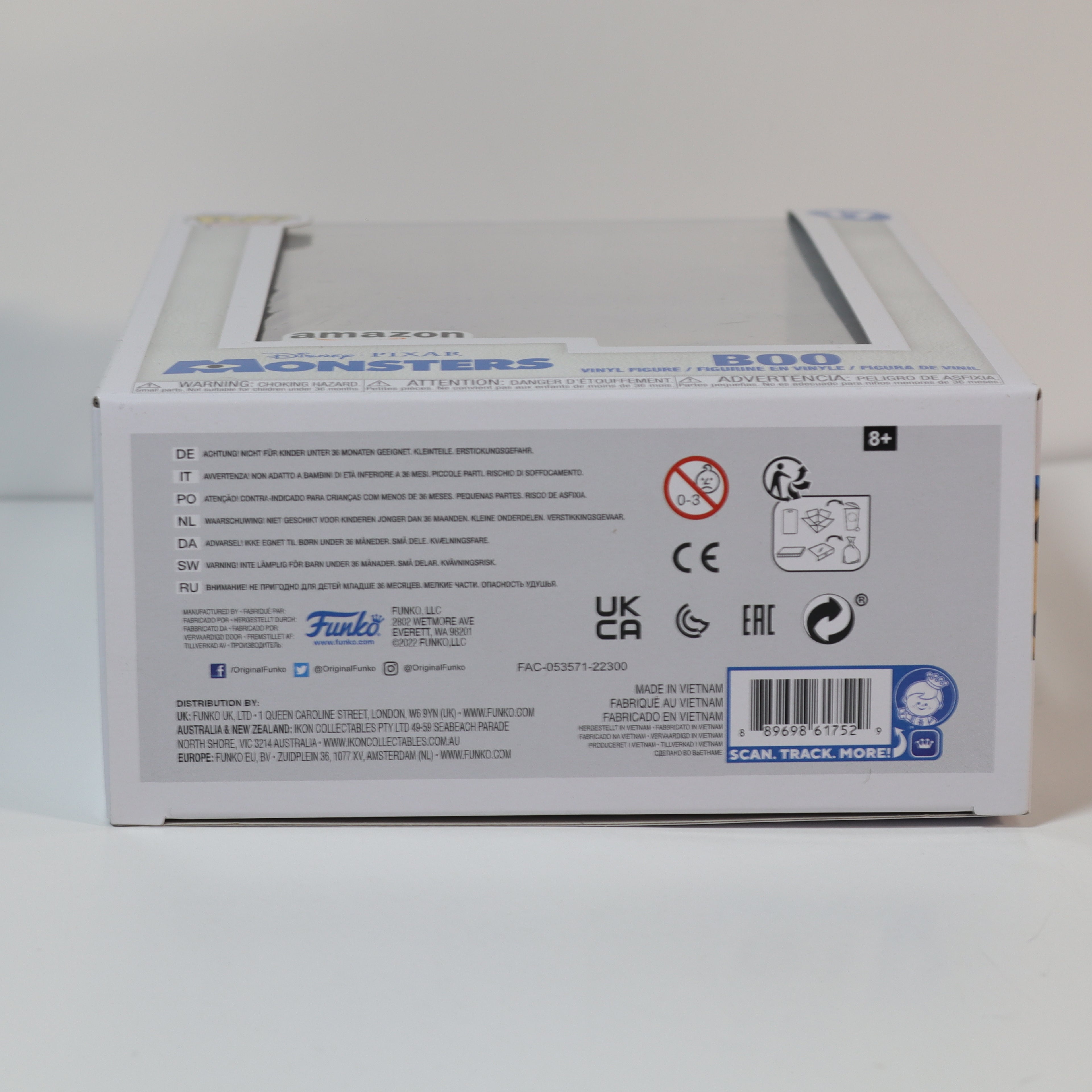 Back view of a product box with text and logos on a white background