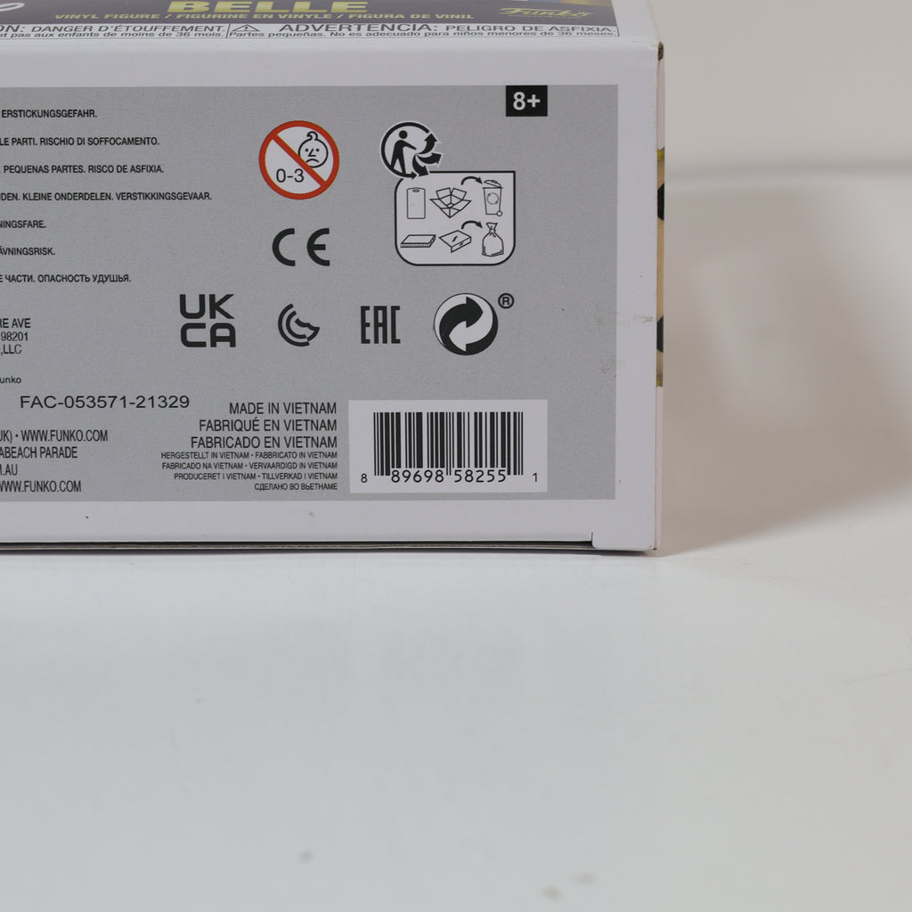 Back of a toy packaging box with various symbols and text on a light gray background