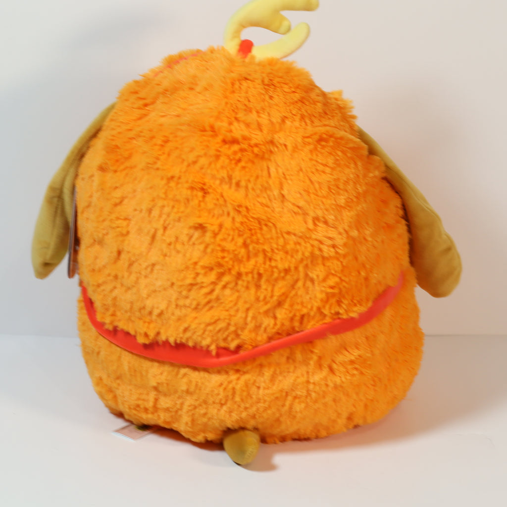 Orange plush toy with a red belt on a white background
