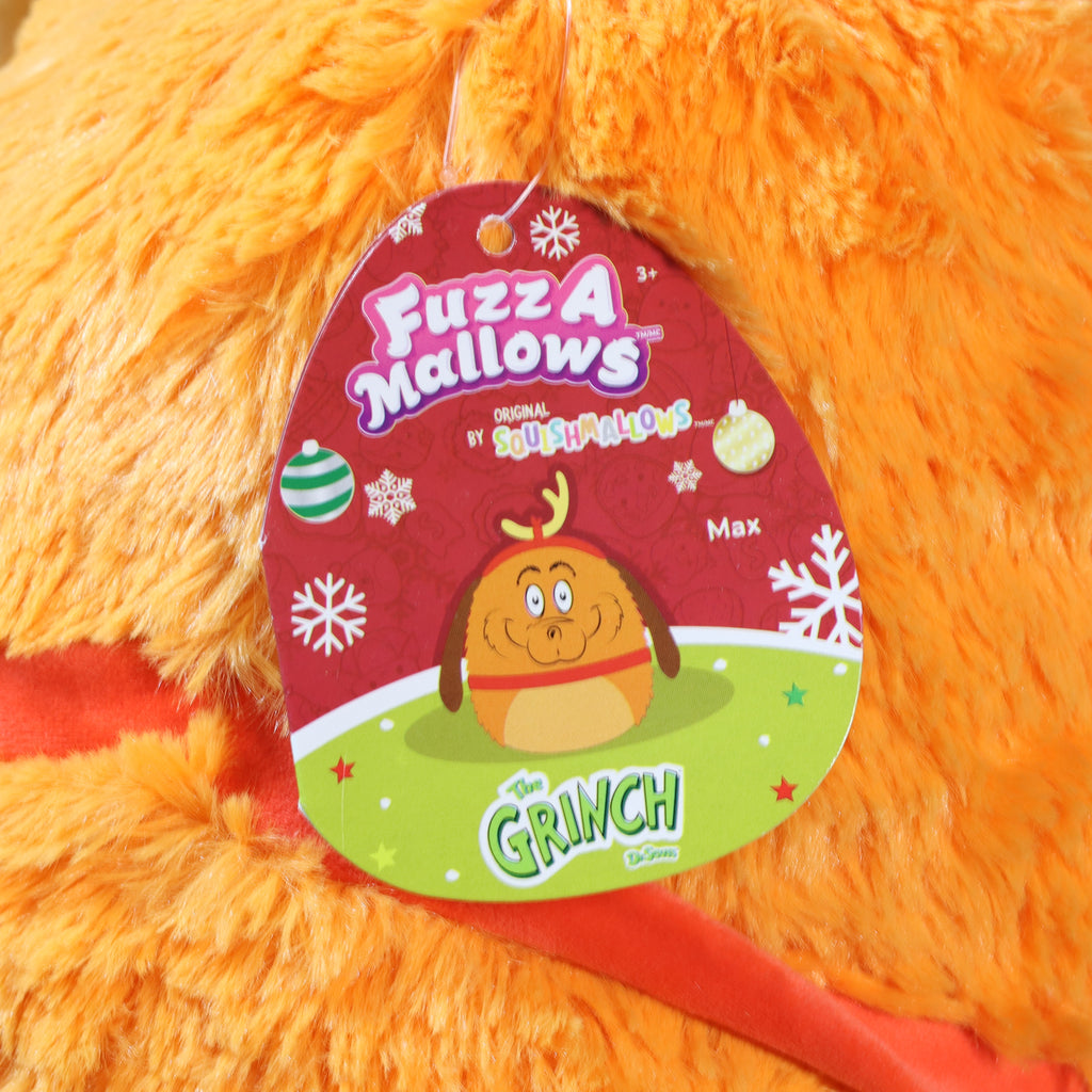 Orange plush toy with a 'Fuzz-A-Mallows' label featuring a cartoon character and text.
