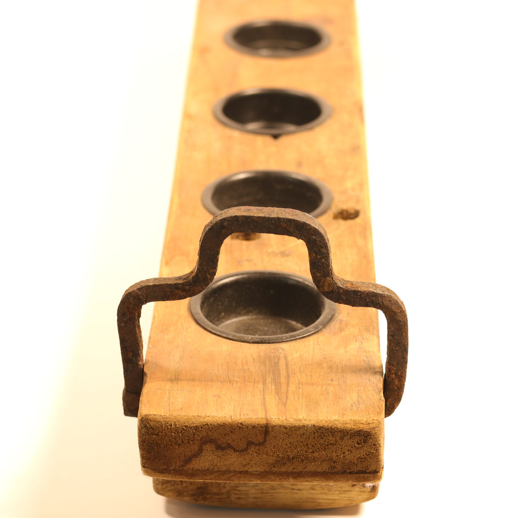 Wooden holder with metal hooks on a white background