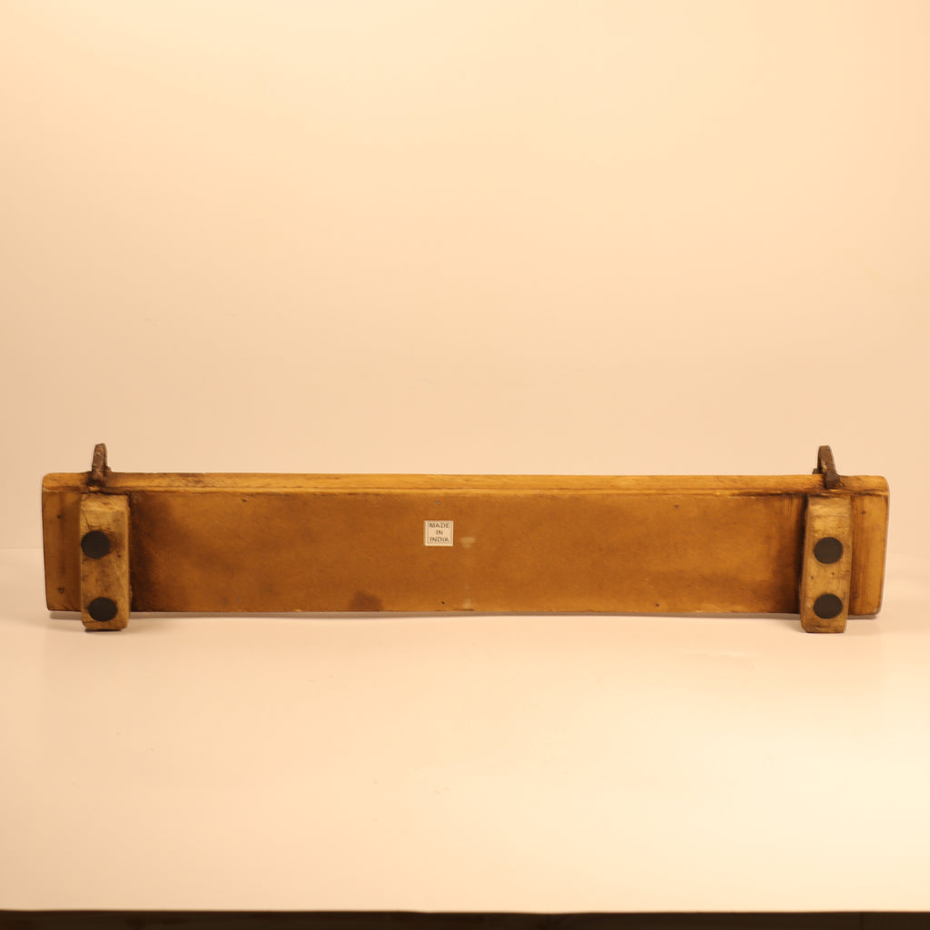 Vintage wooden panel with metal brackets on a beige background