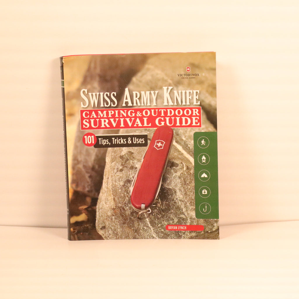 Book titled 'Swiss Army Knife Camping & Outdoor Survival Guide' on a beige background