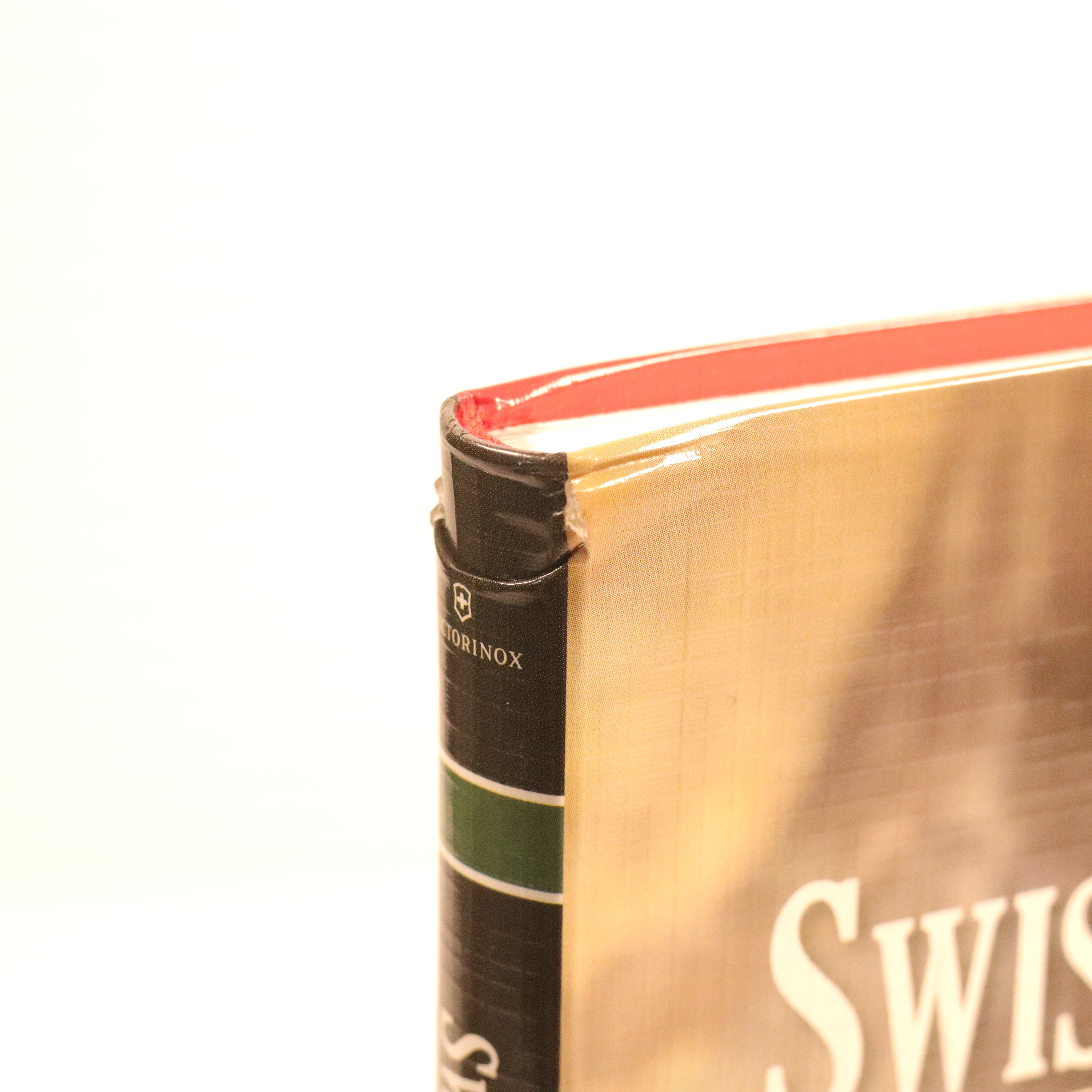 Close-up of a Swiss Army knife with visible branding on a white background