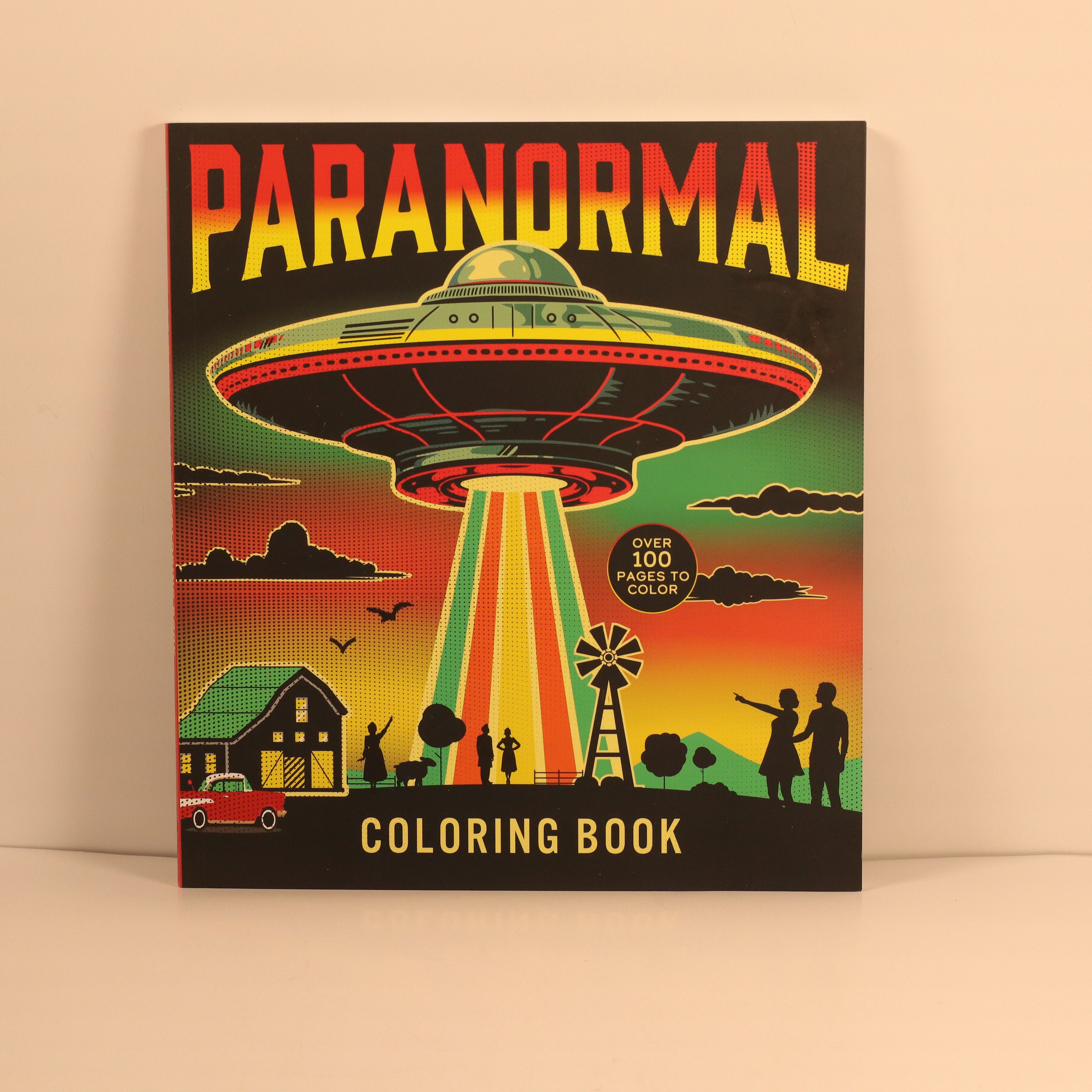 Coloring book cover with a UFO design on a beige background