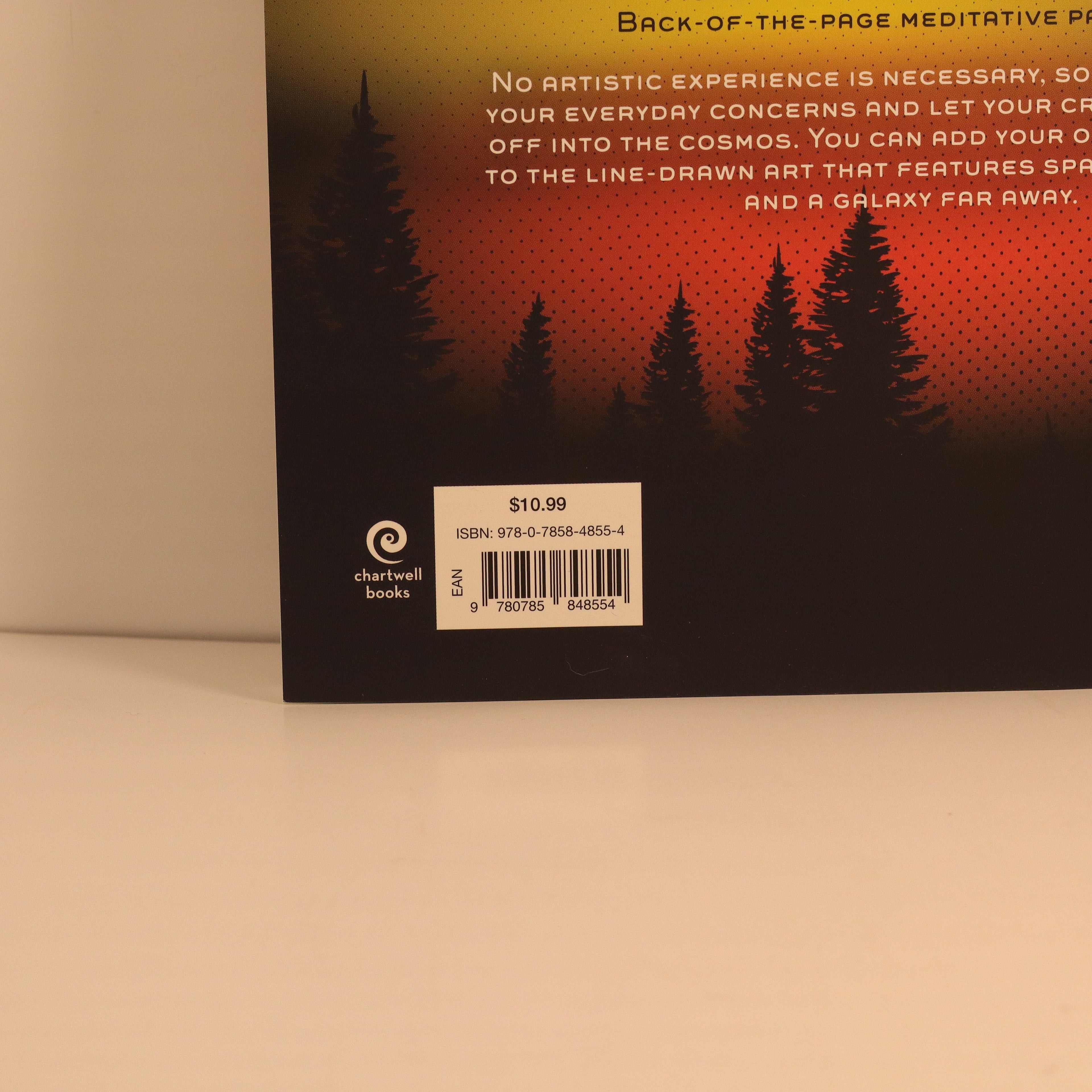 Book back cover with silhouettes of trees and text on a gradient background