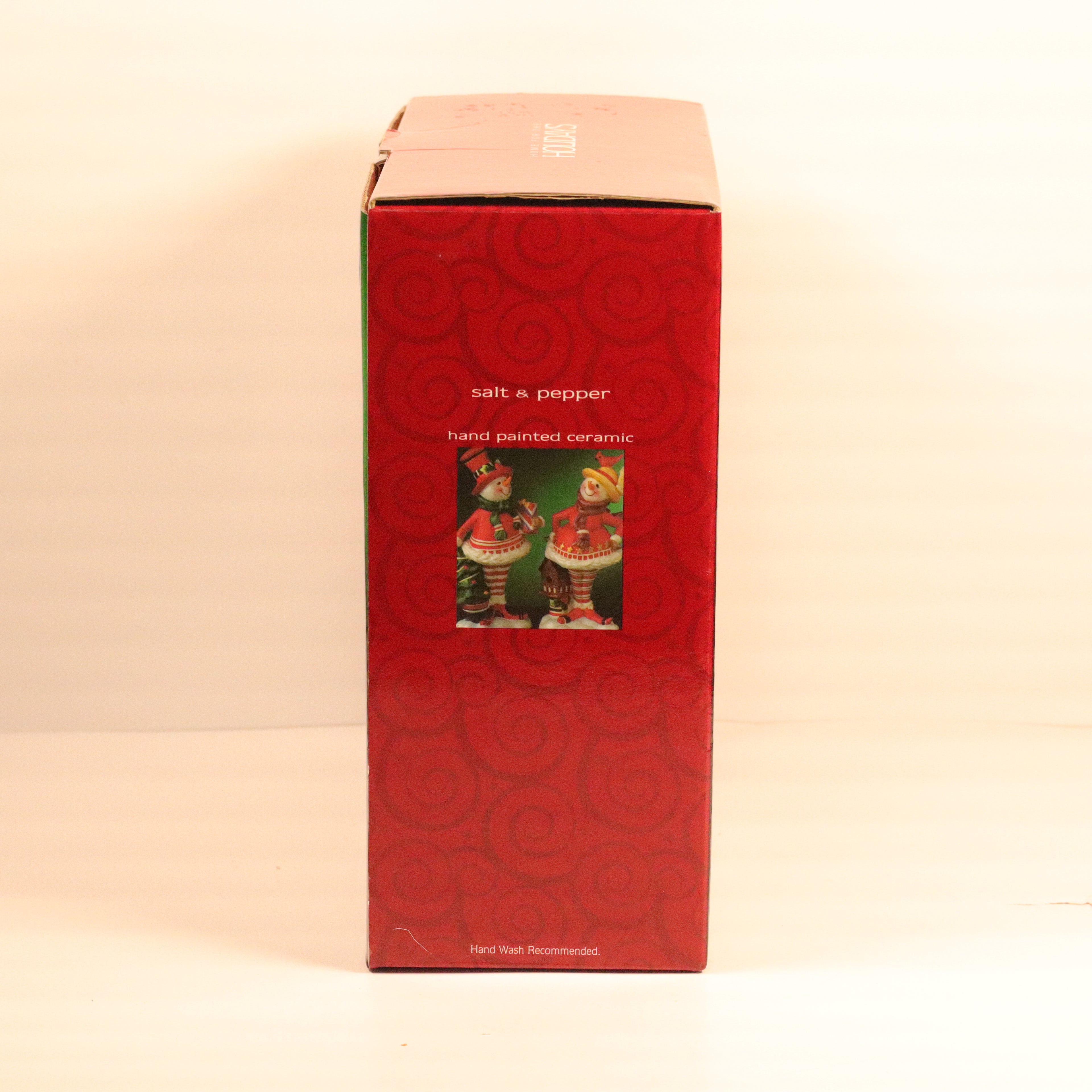 Red box with a picture of salt and pepper shakers on a beige background