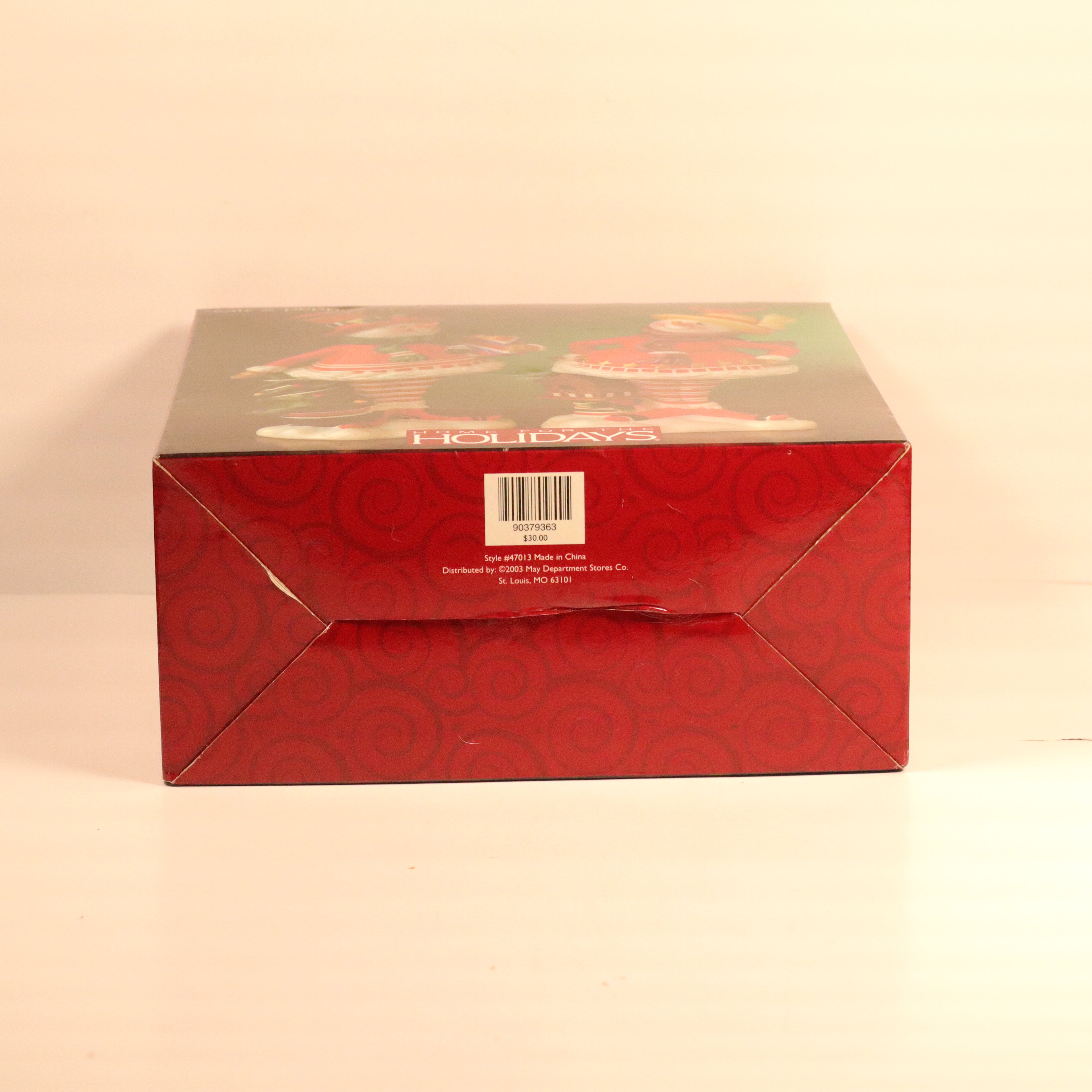 Red decorative box with a pattern on a beige background