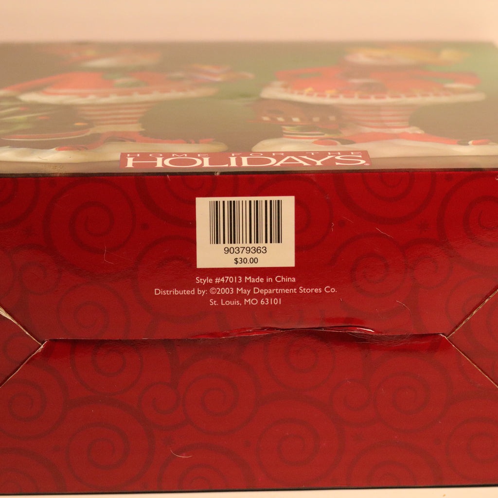 Red gift box with 'Holidays' text and barcode on a beige background