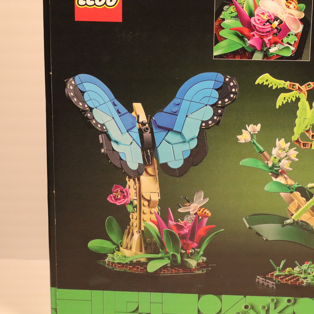 LEGO butterfly set on a LEGO product packaging with flowers and plants.