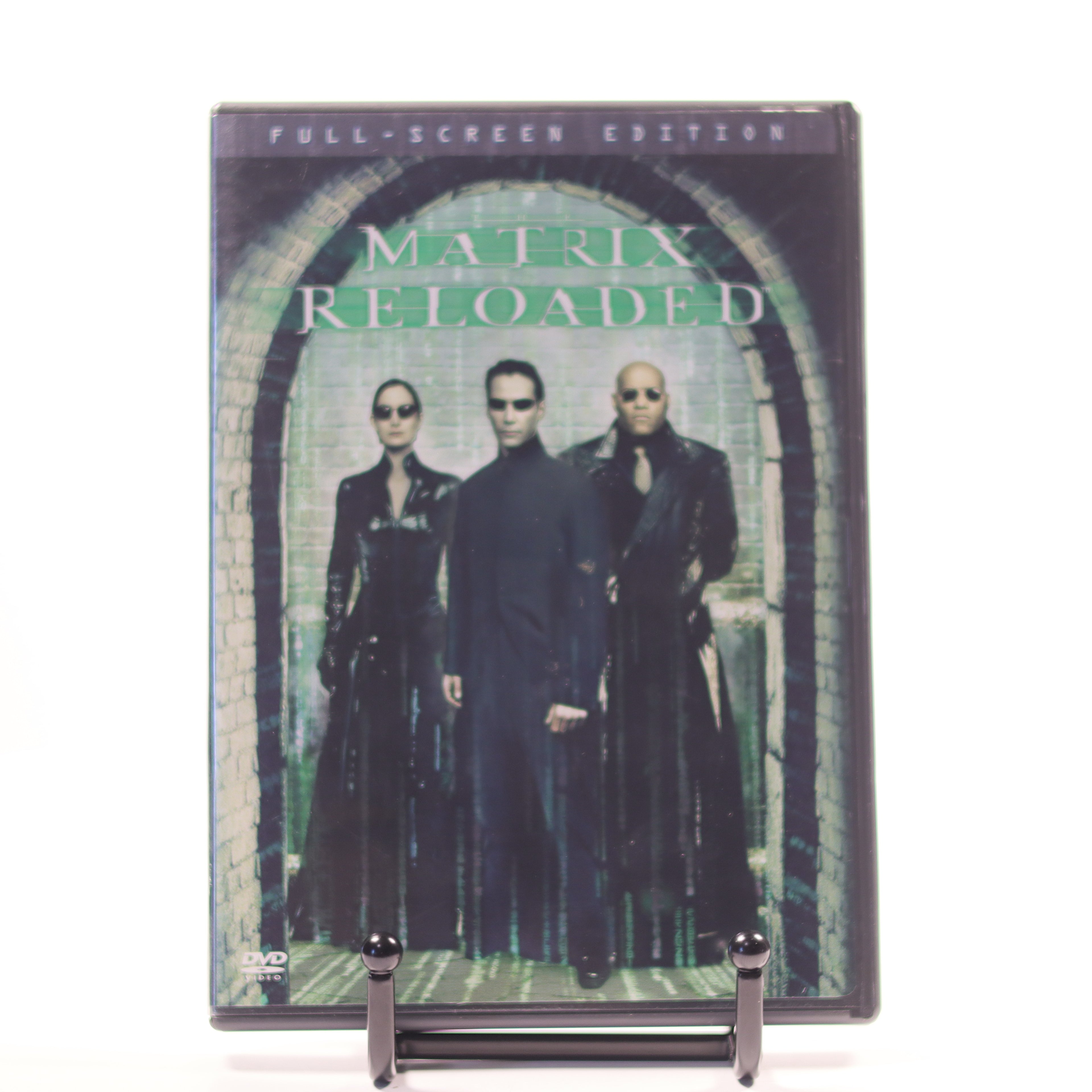 DVD cover of 'The Matrix Reloaded' with characters in black suits on a white background