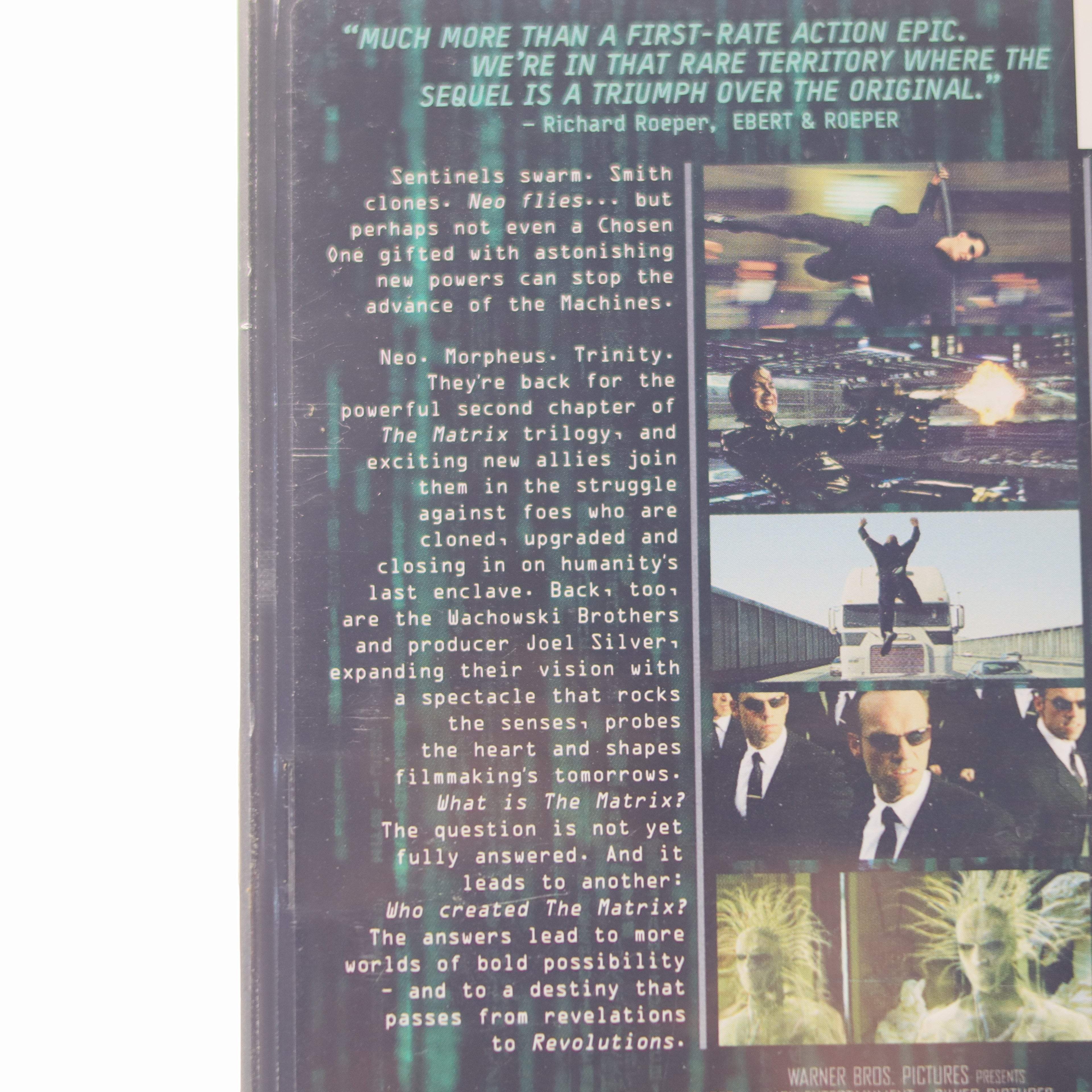 Movie poster for 'The Matrix' with text and images of characters and scenes.