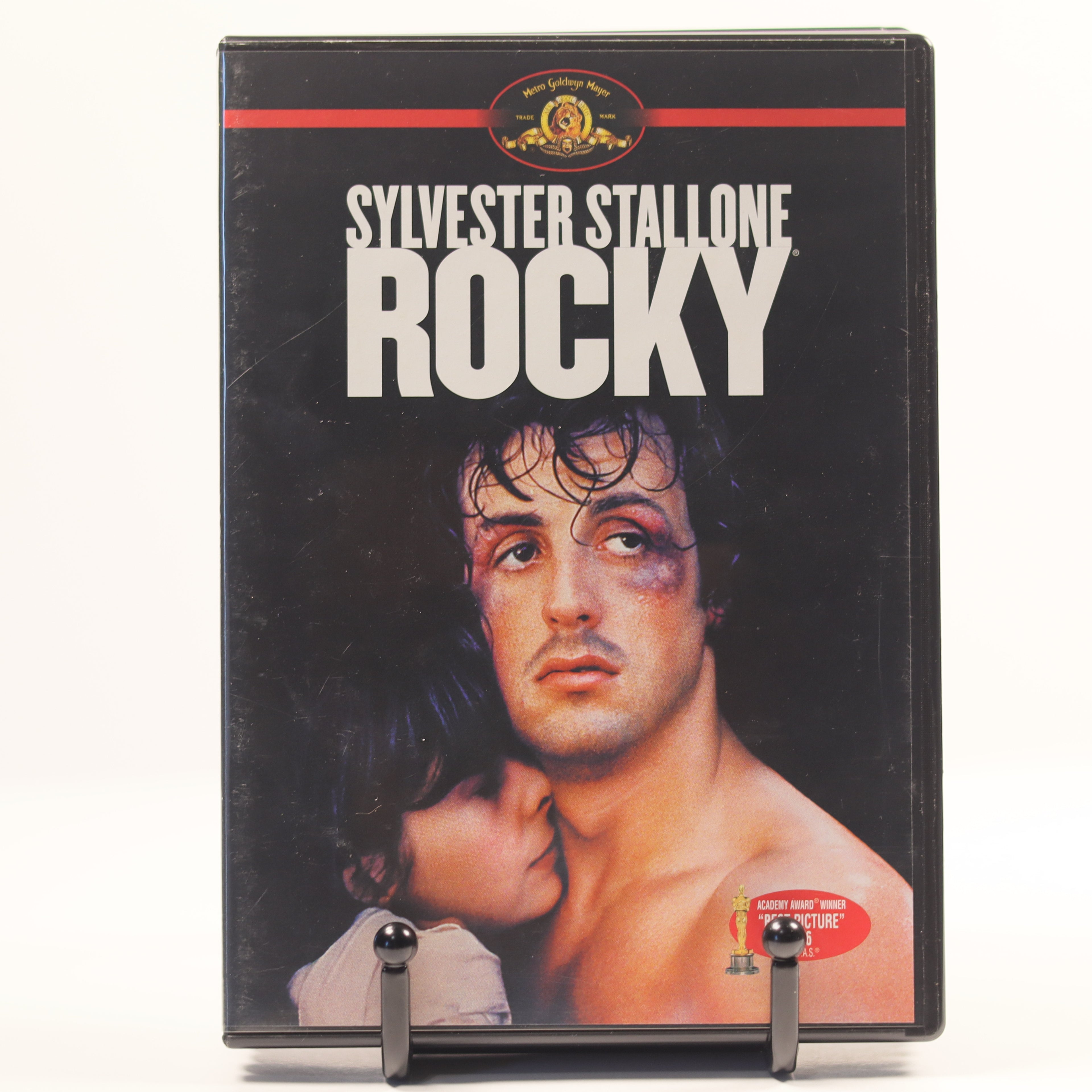 Vintage 'Rocky' movie poster with Sylvester Stallone on a black background