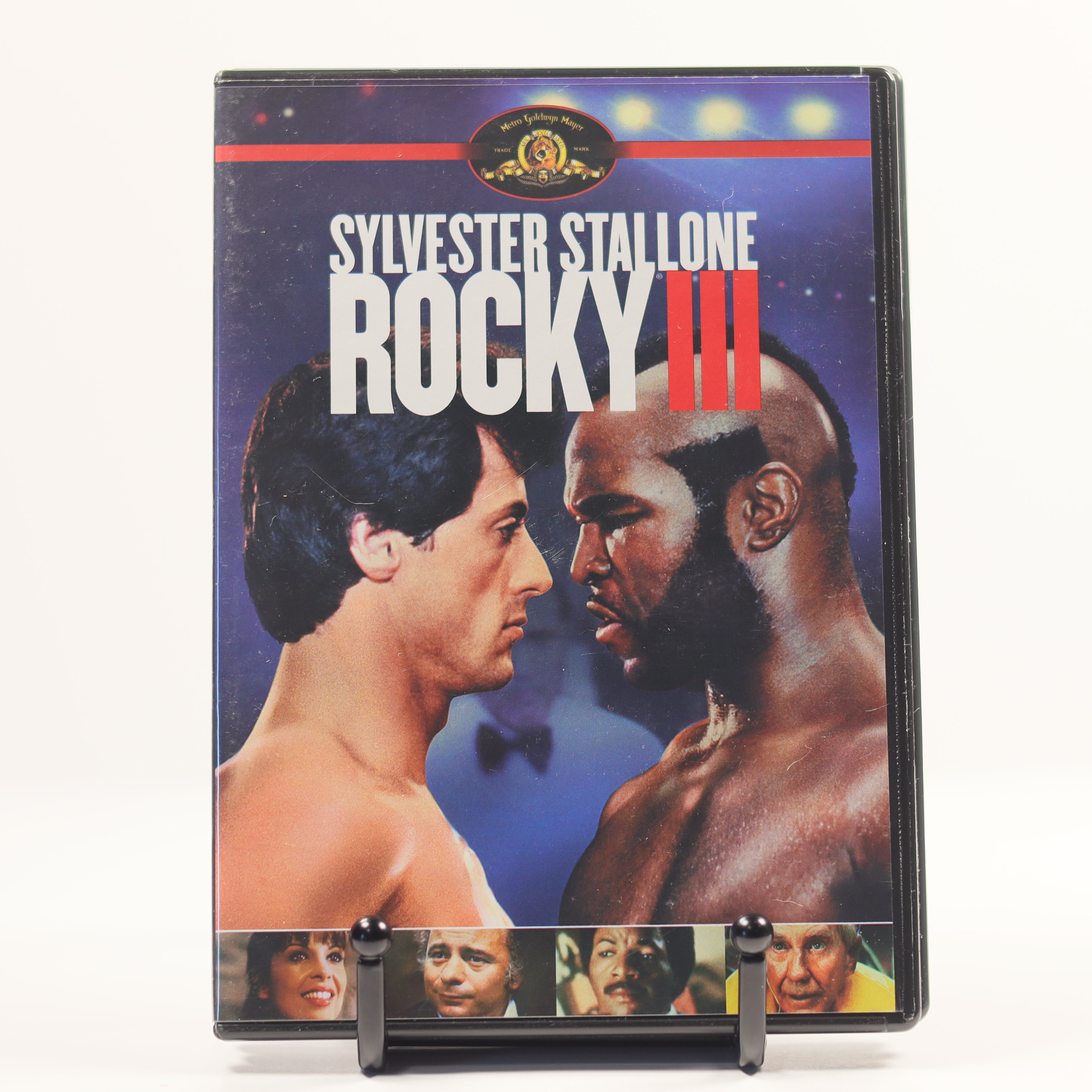 DVD cover of 'Rocky III' featuring Sylvester Stallone and a boxer on a blue background.