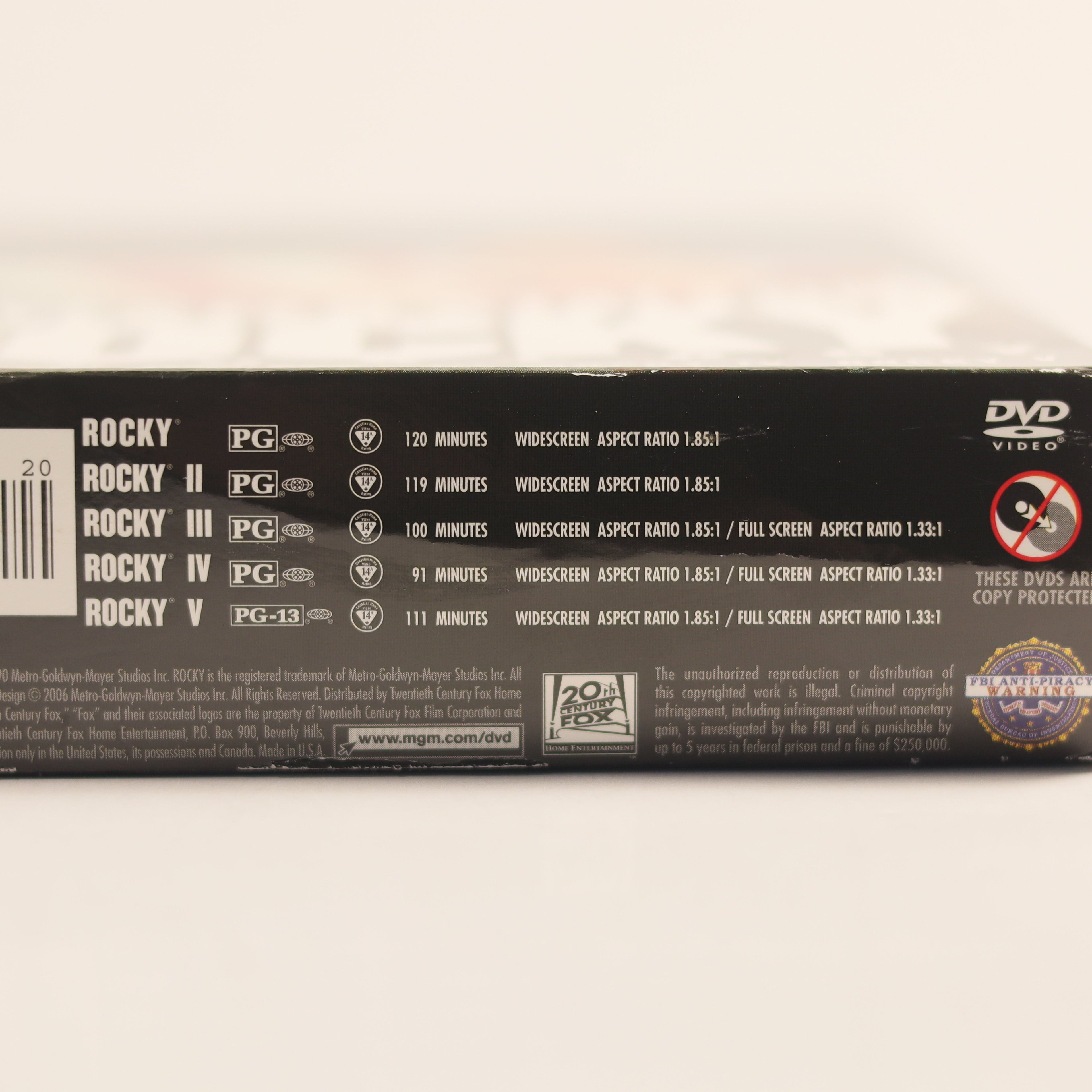 Back view of a Rocky DVD box set on a light background